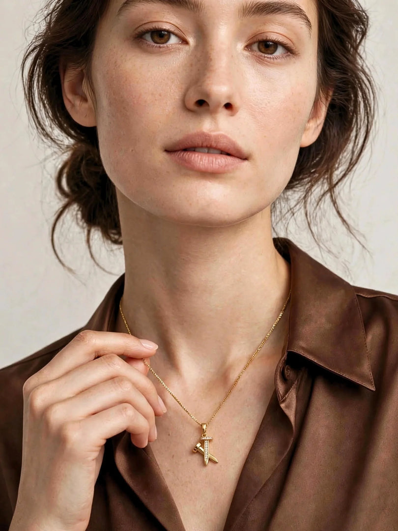 Golden Crossed Nail & Crystal Necklace