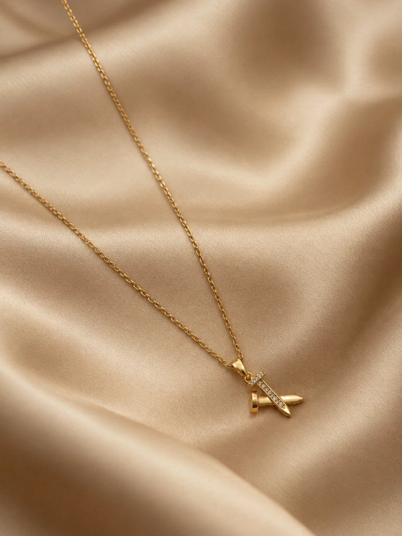 Golden Crossed Nail & Crystal Necklace