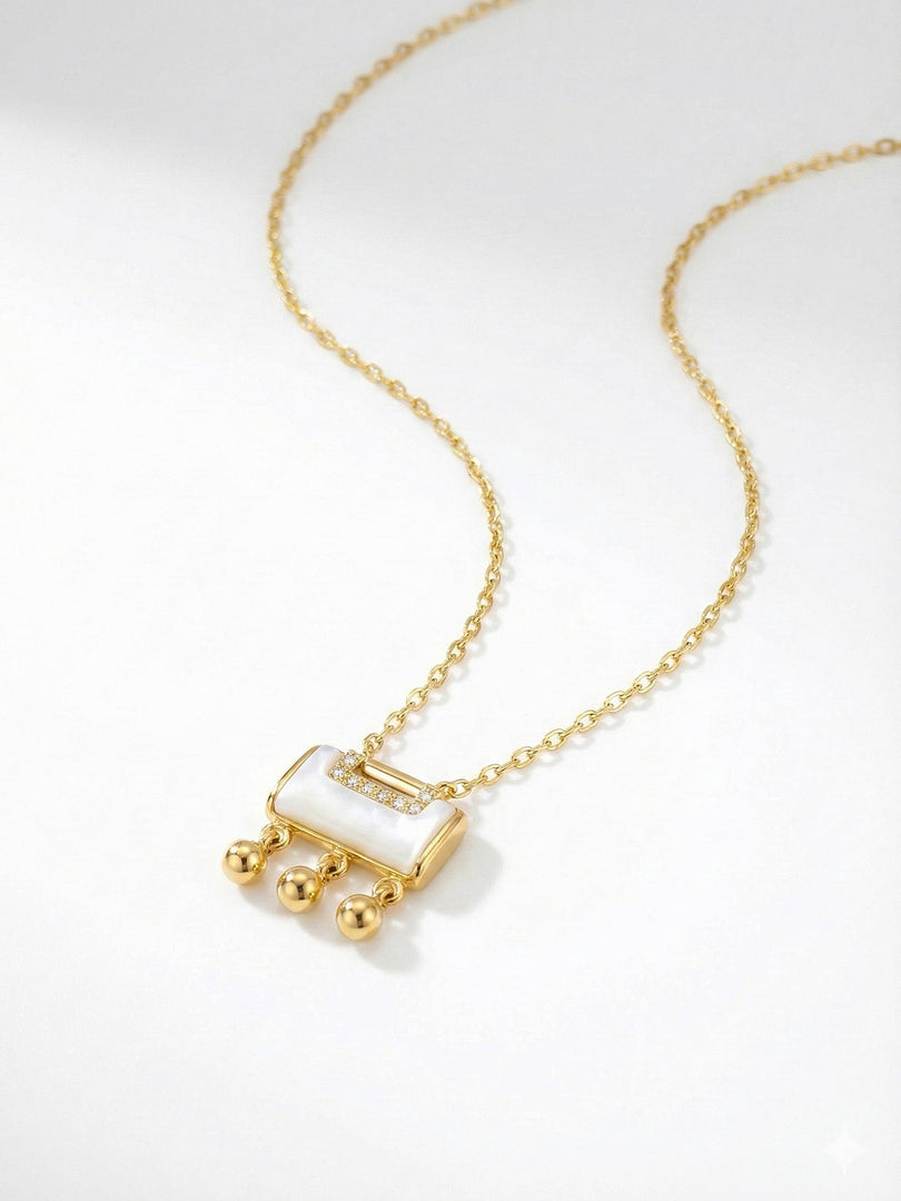 Ivory Cascade Charm Necklace