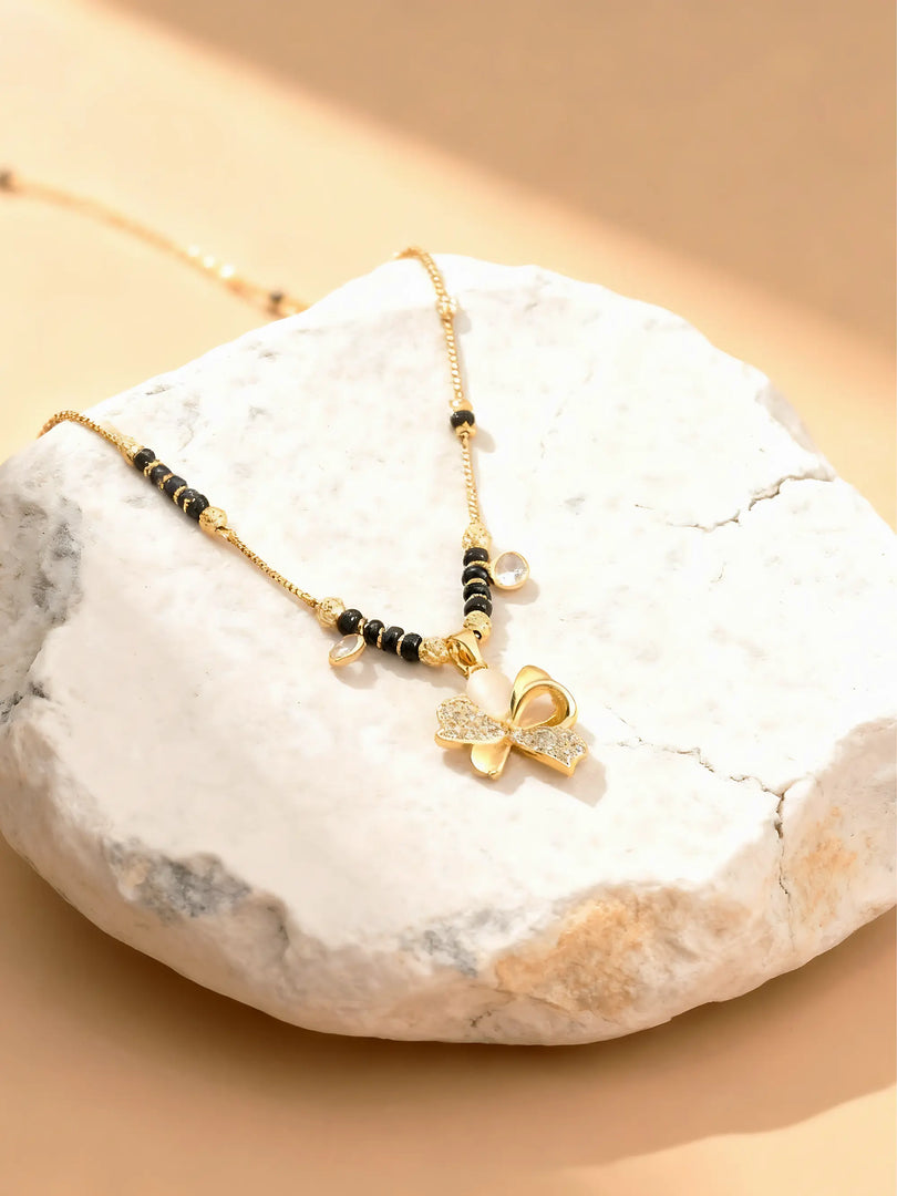 Amulya mangalsutra with black beads and gold-toned pendant