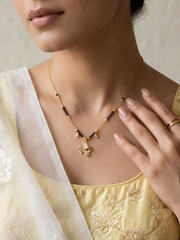 Amulya 18K gold-plated mangalsutra worn by a woman